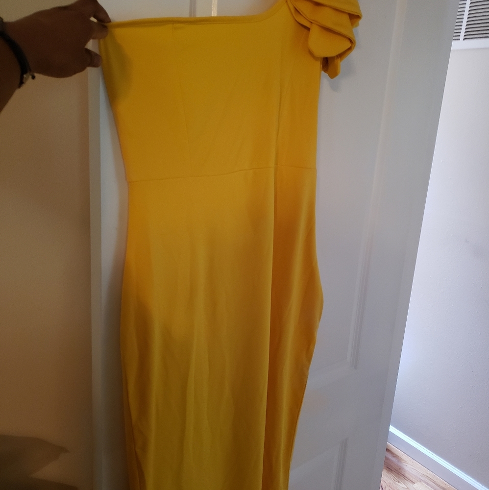 One sleeve knee length dress.